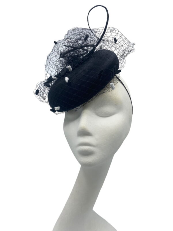 Stunning simple litlle black pillbox with gorgeous monochrome pompom veiling overlay.